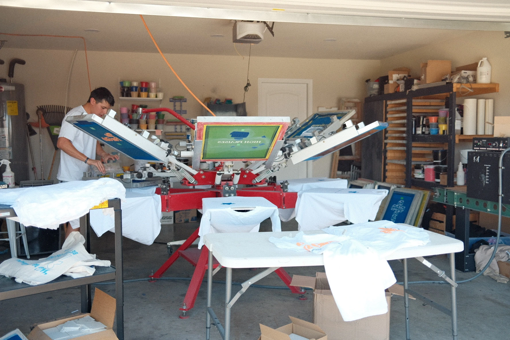 Six12 Printing team with t-shirts from a 2500-shirt order in Dallas.