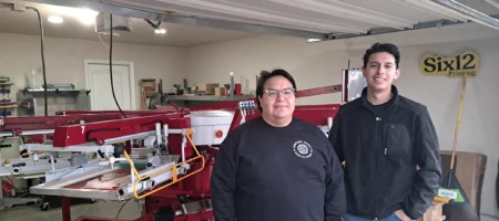 Jon and Joe screen printing in their Dallas garage for Six12 Printing.